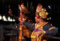 Detailed shot of a traditional Balinese dancer performing indoors in Bali, Indonesia.